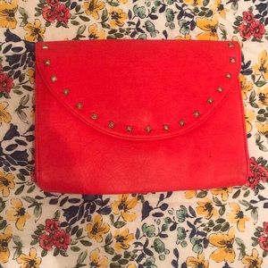 Red clutch with studs